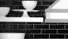 This is a detail showing the texture of the bricks installed using silver grout that adds a graphic element to the walls.