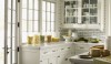 White bricks are installed floor to ceiling in another great kitchen designed by Steven Gambrel.