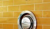 The modern .25 thermostatic shower valve with its on/off wall valve.