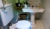 This could possibly be the smallest powder room I have ever been in, but the vintage sink is remarkable and the objects keep you in the space far longer than necessary!