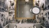 Lonny_2-e1277848839463 Another decorative space (wallpaper is making a comeback) with decorative sconces on either side of the mirror and that all important magnifying mirror for applying makeup.