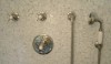 clip_image006-e1280436608465 The 1cm mosaics are a tightly gridded background for the elegant, updated and classic Easton shower fittings. He used a thermostatic shower valve with one wall valve to turn on the wall mounted shower head and the other to operate the hand shower. We all agree that it is hard to imagine keeping a shower clean without the availability of a hand shower.