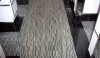 The floor at the London is a mosaic using short strips of stone. The result is a light texture and softened color.