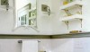 0107MSL-e1284557591734 The shape of this mirror adds interest to the space. The shelves are interesting as well and a great place for decorative objects. The dark chair rail is a bit harsh and competes with all of the design elements in the room.