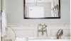 House-Beautiful-e1284557437240 A simple frame with mirrored squares held in place with decorative tacks is a nice finishing touch to this installation.