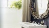 dominothebookofdecorating_mirror-e1284557427897 Twisted twigs make a truly original mirror. The texture is great and the scale somewhat oversized for a dramatic effect. I love the drama of the dark walls as well.