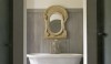 sallesdebains_mirror2-e1284557416237 A mirror installed in an architectural fragment with a lovely old finish is just the right decoration over a footed traditional bath.