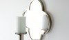 The lovely Clover sconce with pillar candle facsimilie can be both casual and formal. It will look good in a bath or a foyer.
