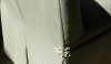 OLYMPUS DIGITAL CAMERA Deep pleasts on the back make this chair attractive front and back. The Decorative "frog" closure is a fine dressmaker detail.