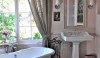 Seating_and_the_bath Brooke Gianetti has such an incredible design style. In the newly painted bath in her house, she accented the warm shade of pale pink with this exuberant splash of deep rose for her tufted stool.