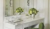 This vanity/makeup space is so feminine and decorative. The application of sconces on a wall to wall mirror makes the room sparkle.
