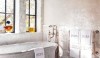 There is no question where these towels belong. Large scale but elegant, these words decorate Betty Lou Phillips' own bath.