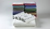Decorative borders and monograms decorate Waterworks Made to Order Gotham towels. The threads for the decoration match the more than 100 colored borders.