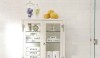 This simple white vintage medical cabinet is great for storage and I love the words that identify the towels that are stored inside.