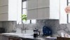 Backsplash1 This kitchen has slab Calcatta counters and backsplash. This particular piece of marble makes the backsplash interesting because of the natural "activity" in the the stone.
