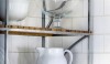 Backsplash7 Simple matte white 6 x 6 tile set in a staggered pattern creates a nice grid behind this decorative display shelf.