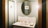 backsplash14 This washstand fits perfectly into a well lit alcove. The shaped backsplash creates a focal point for the space.