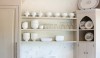 backsplash16 This subtle installation of Cararra marble slab keeps the installation very quiet. It allows the eye to travel quickly to the collection of white ceramics.