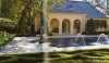 Betty-Lou-Phillips-Blog_6016-e1295903431678 A final look at the rear of the grand exterior with a spouting pool and formal gardens. This is a memorable house where every detail has been planned and exectued to perfection.