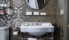 Betty_Lou10 A charming powder bath with a damask style wallpaper juxtaposed against an unexpected plaid mosaic floor. The glamorous wallpaper and the floor are a sophisticated weaving of styles.