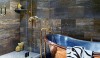 Betty_Lou8 Dark, rich and masculine with travertine walls. A deep, French hand-made copper soaking tub.