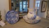 Vintage-Bath-Accessories1 Ceramics have a place on a tub deck or knee wall to hold sponges or an assortment of towels or soaps. These with blue decoration add just a small splash of color in the bath. You might select blue towels to complete the blue story.