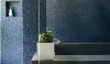 Grout004-e1299880885538 A dark glass mosaic is grouted with complimentary grout. The reflective quality of the glass does not need the distraction of contrasting grout.