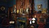 Finest_Homes_005-e1297983101281 This is the library at the Mark Twain house with its elaborately carved oak mantle inspired by a room at Aytion Castle in Scotland. There is a great collection of expensive books, objects and paintings housed in the room. The decoration is the best of Victorian design.