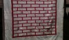 Just a simple brick pattern outlined in white is graphic and effective. Perhaps the early work of a young quiltmaker.