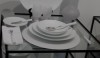 Muriel-Grateau6 Crisp and clean for this white setting. Notice that all of the plates in her entire assortment are the same design. I like the matte white glassware and white napkins here. This means that the food is really the star.