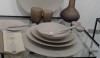 Muriel-Grateau7 Three warm shades of taupe, from the dishes at mid tone to the light napkin and darker sanded glass ware. This is neutral to the extreme but very friendly.