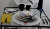 Muriel-Grateau8 For your next art party, this is the setting you might select. These dishes will be a topic of conversation. I love the yellow napkins and the black accents.
