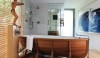 Not only is the bathtub sculptural, but the art adds another large scale presence to the space.