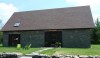 L1020430 The house was inspired by the Iroquois "long houses" that dotted the Husdon Valley landscape for centuries. The beautifully austere exterior is softened by the native stone.