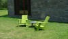 L1020434 The outdoor chairs echo the simple forms of the house. The color brightens the landscape.