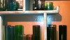 Colored glass containers could be just the splash of color that is perfect in an all white bath.