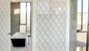 Modern trellis panel doors with opaque glass, designed by Roy McMakin.