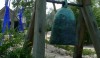 The 1993 Gateway Bell, by Toshiko Takaezu greets you at the entrance. Standing behind it set in light colored sand is a Dale Chihuly bright blue glass sculpture.
