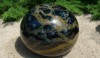 When we were there in July, the staff was preparing for a gala honoring Dale Chihuly. This glass ball is by Dale Chihuly, part of a group of three.