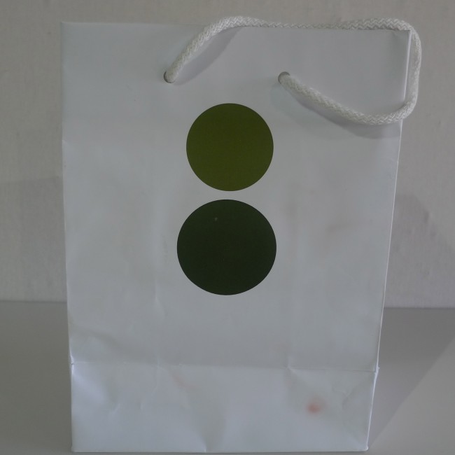 The Ã¼ber cool Colette in Paris is clearly a destination for boutique lovers. The logoâ€”two bold dotsâ€”changes color with the seasons. If only to carry a designer bottle of water, this is a bag to own.