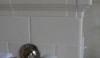 My favorite towel bar with milk glass ends and crisp turned details. Also note the corner detail of the tile installation.