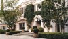 The facade of a house in LA whose once famous inhabitants give it a certain pedigree. The brick facade with its quoin details and swan neck pedant over the doorway, conceal a less than ideal interior. A completely remained interior was designed by the architects with gracious rooms and high ceilings resulting in a "casual formal" house.