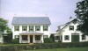 A Pennsylvania farmhouse transformed into a dignified country house presiding over the landscape. The architects surgically remodeled the house by re-proportioning details, adding a window and balancing parts.