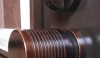 Custom bronze door knobs appear throughout the house and repeat on the ends of the drapery rods.
