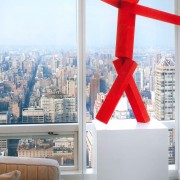 A Joel Shapiro sculpture against the Manhattan skyline.