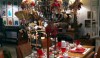 Holiday dining Holiday dining at its best. Red glass dishes and crisp white linens, a decked out chandelier, and you are ready to receive guests.
