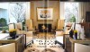 A very large living room, divided into 3 distinct seating areas. The room showcases a number of precious objects from  the andirons to great contemporary art. A 'Great White' Moroccan rug anchors upholstered pieces with rich texture.