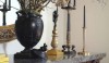 This is a rare basalt Pegasus vase from Wedgwood c. 1800. It is flanked by 19th century French candlesticks. This is a rich assortment of carefully chosen objects.
