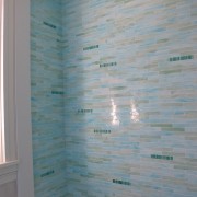 10.6.2011 030 An early stage installation shot—a freshly grouted wall in the bathtub.