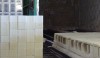 L1020959 Setting racks filled with glazed tiles ready for firing in the large kiln.
